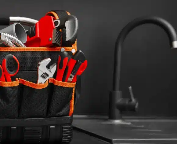 various tools in a bag on a sink